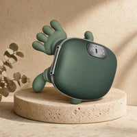ComfyHug massager side view on a stone pedestal